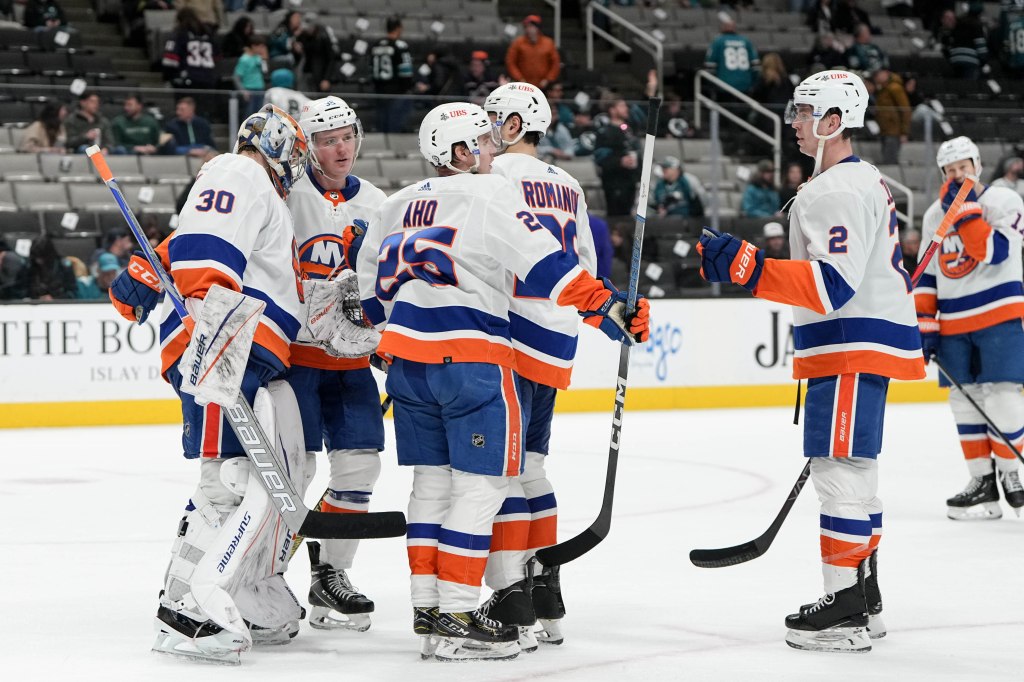 The Islanders celebrate after their 7-2 win over the Sharks.