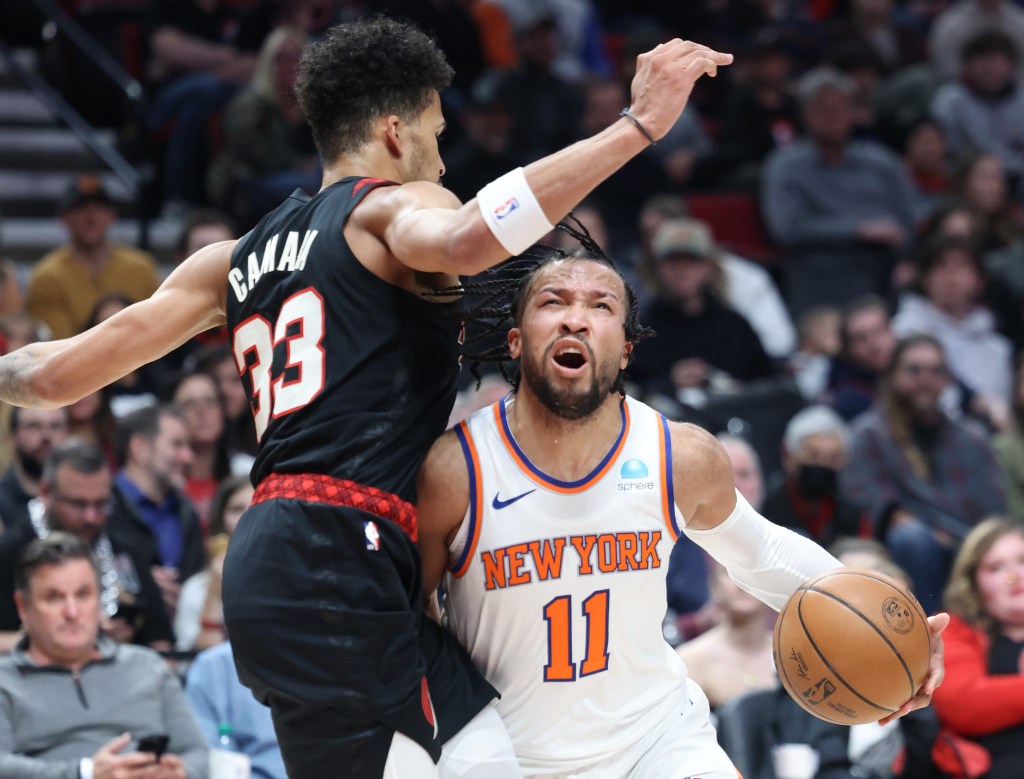 Jalen Brunson is fouled by Toumani Camara during the Knicks' win. 