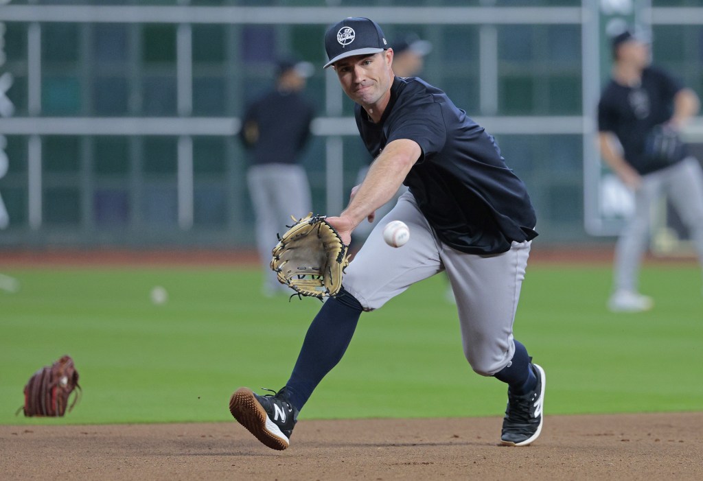 Jon Berti, who did not play in the Yankees' Opening Day win, takes ground balls during pregame warmups.