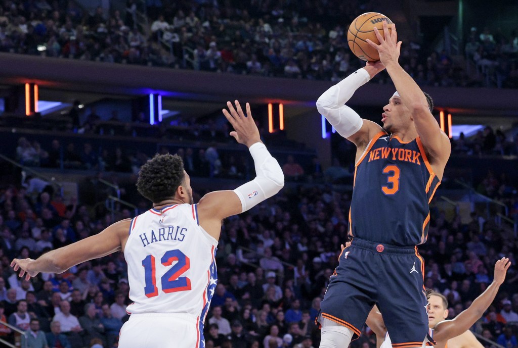 Josh Hart, who had 20 points, 19 assists and 10 rebounds, shoots a jumper over Tobias Harris during the Knicks' 106-79 win over the 76ers. 