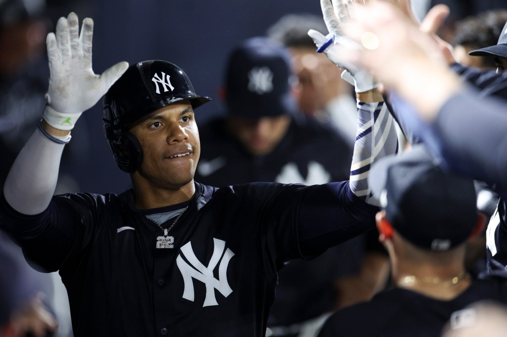 Juan Soto celebrates with teammates after hitting a solo homer in the fourth inning of the Yankees' exhibition win.