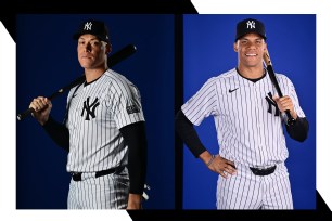 Yankees stars Aaron Judge (L) and Juan Soto pose for photos.