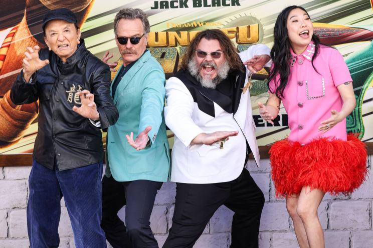 James Hong, Bryan Cranston, Jack Black, and Awkwafina smiling for a photo at the world premiere of Kung Fu Panda 4 in Los Angeles.