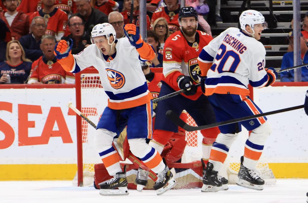 Mathew Barzal (left) celebrates after scoring the game-tying goal in the Islanders' win.