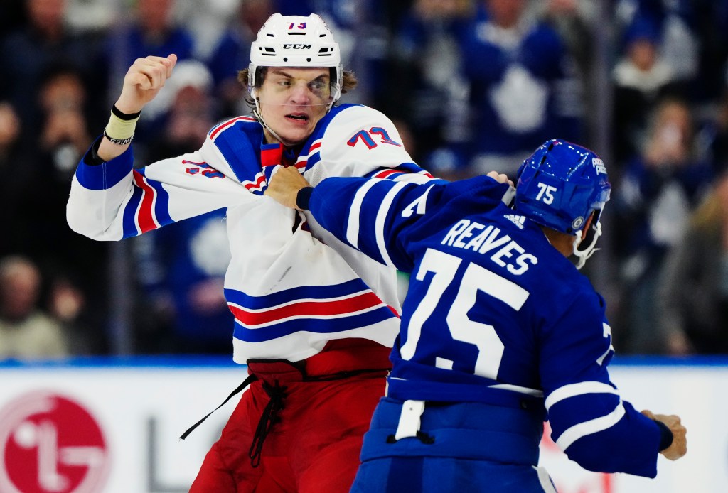 Matt Rempe and Ryan Reaves fight during the third period of the Rangers' shootout loss.