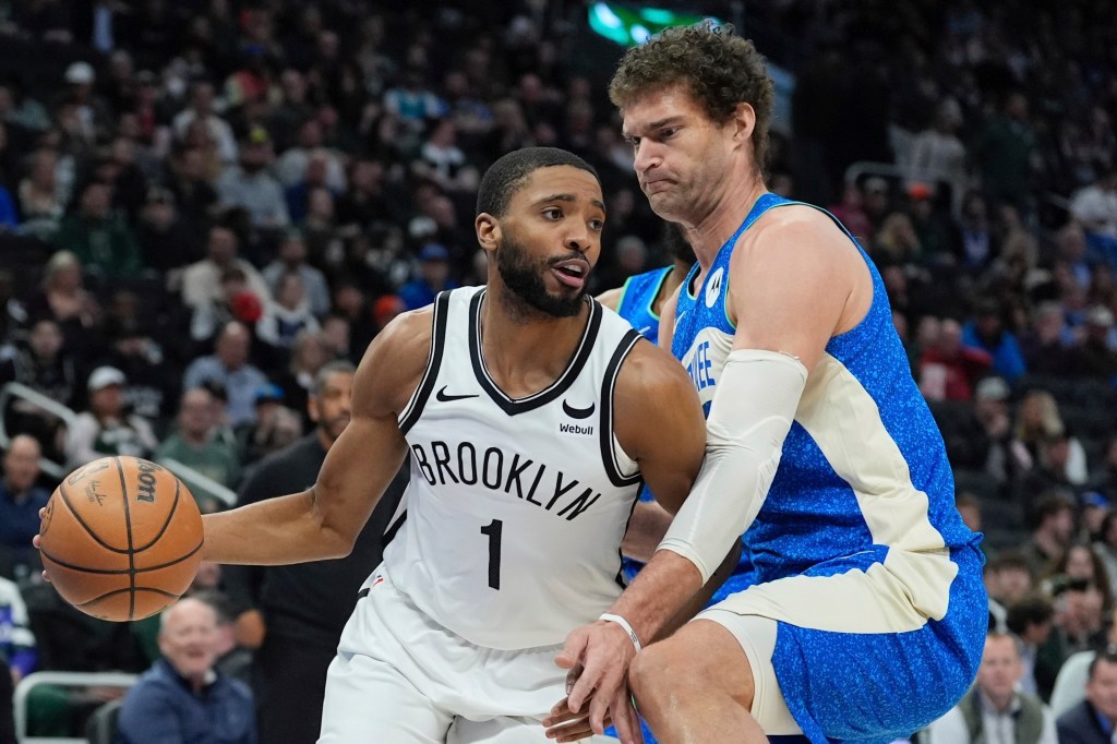 Mikal Bridges, who scored 24 points, drives past Brook Lopez during the Nets' loss.