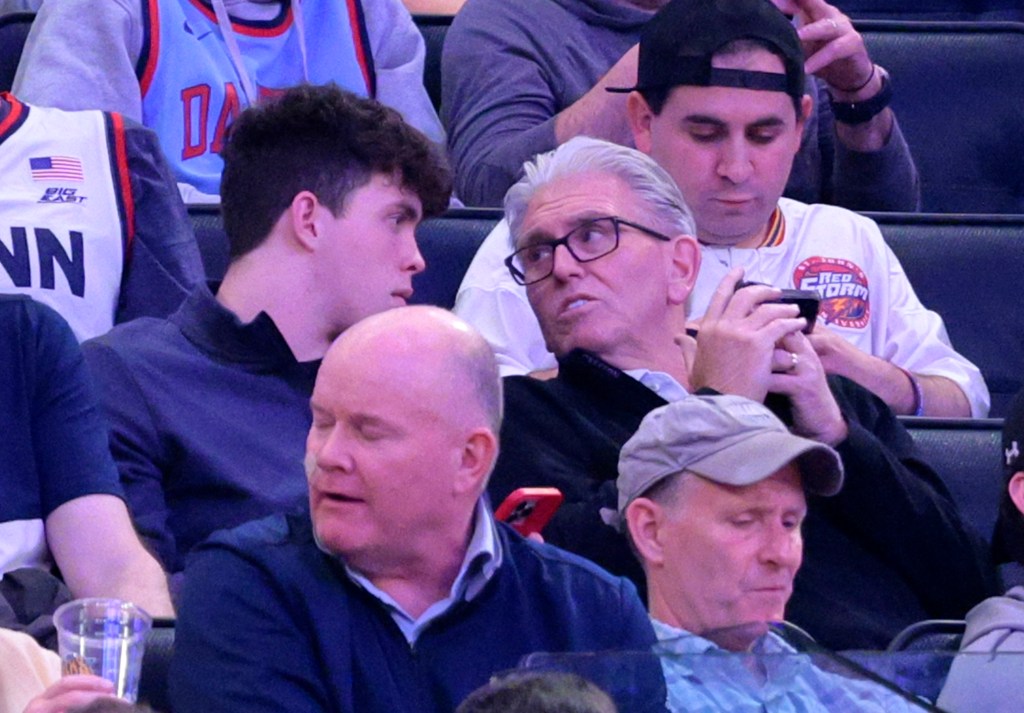 Mike Francesa watches the St. John's-Seton Hall game with his son.