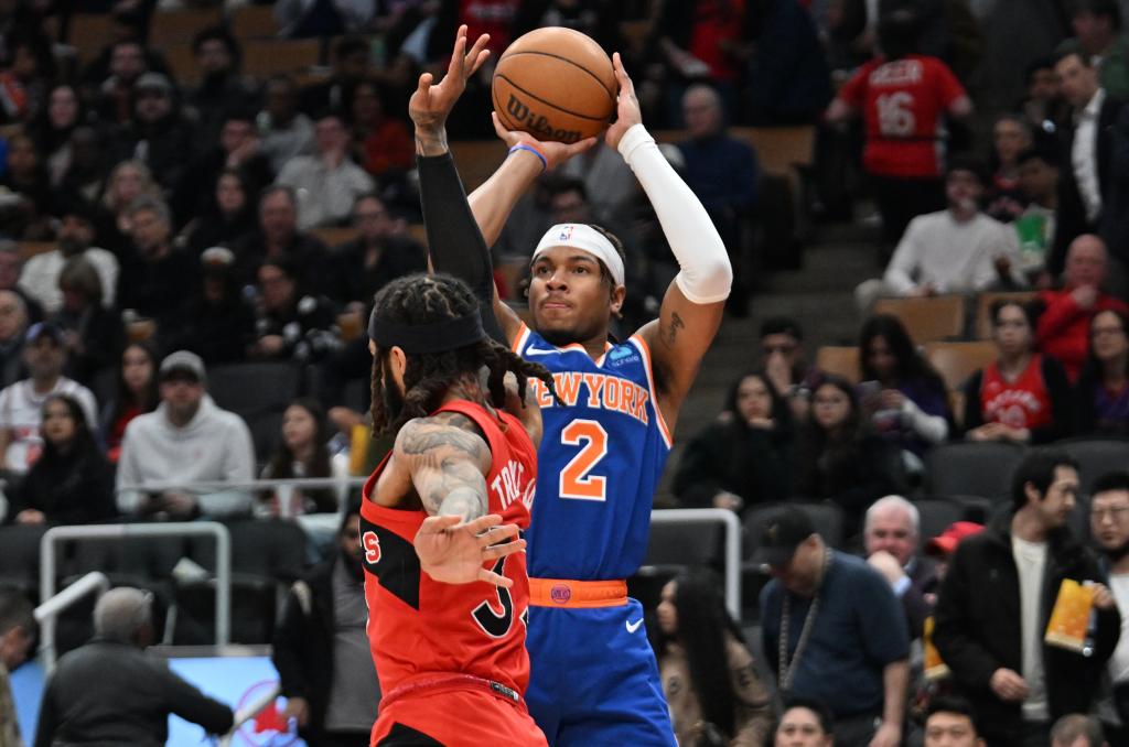Miles McBride, who scored a game-high 29 points, shoots over Gary Trent Jr. during the Knicks' win.