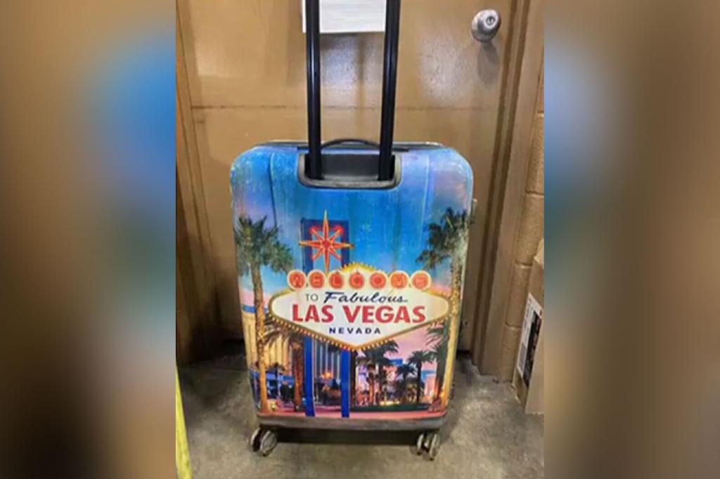 brightly colored suitcase with “Welcome to Fabulous Las Vegas Nevada” written across it 