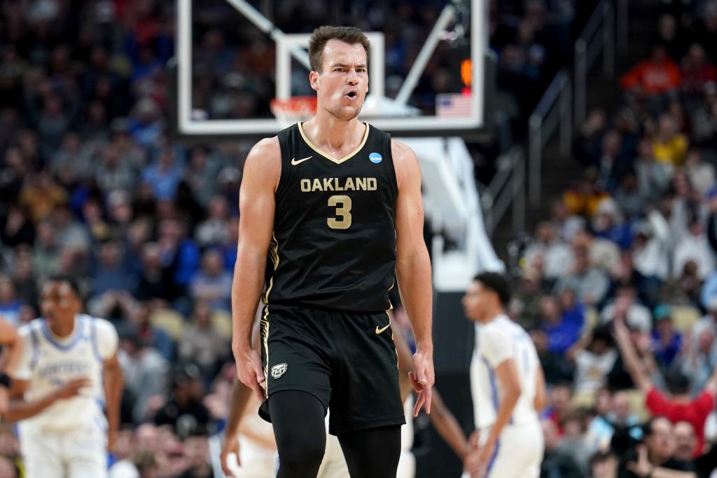 Oakland's Jack Gohlke (3) reacts after hitting a 3-point shot against Kentucky during the second half of a college basketball game in the first round of the men's NCAA tournament Thursday, March 21, 2024, in Pittsburgh. 