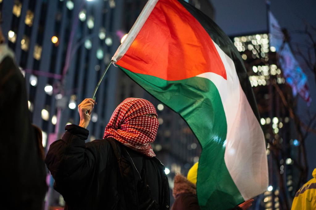 A person holding a flag at a Palestine Protest in New York City on March 28, 2024