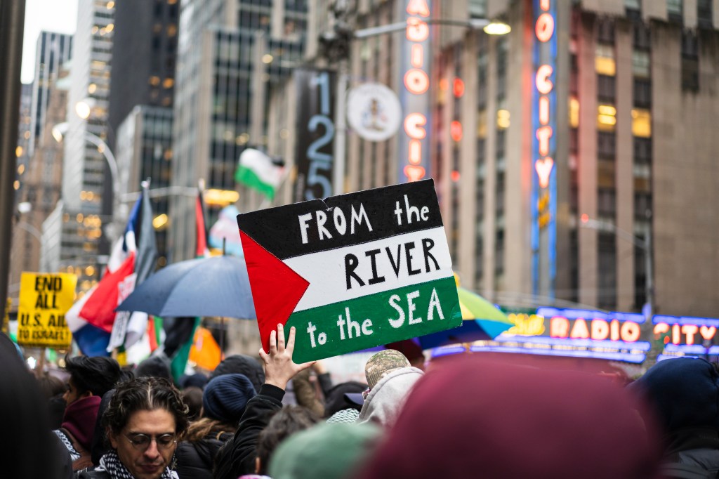 The droves of angry demonstrators surrounded the iconic venue on Sixth Avenue.