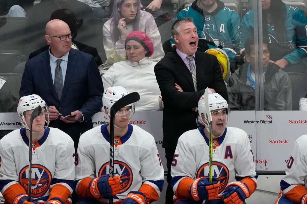 Patrick Roy (right) yells out instructions during the Islanders' 7-3 win over the Sharks. 