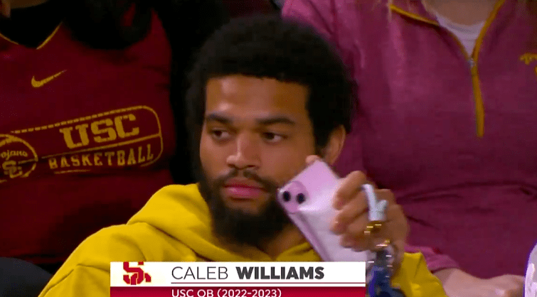 Caleb Williams had a pink phone and appeared to have pink nails at USC's women's basketball game on Monday.