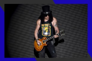 Guns N' Roses guitarist Slash rocks out onstage.