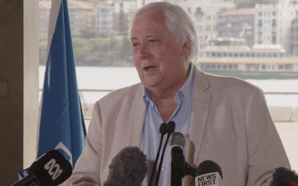 Clive Palmer speaks into microphones on the set of "Titanic II 2".