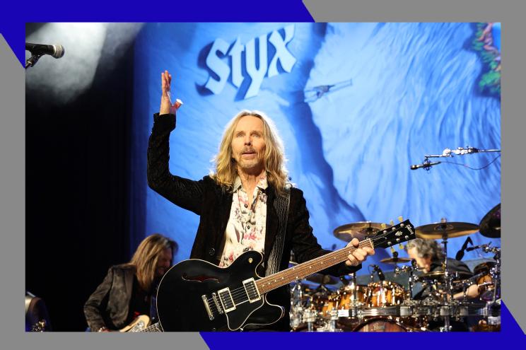 Styx frontman Tommy Shaw gestures to the crowd while performing.