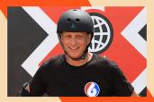 Tony Hawk smiles while wearing a helmet.