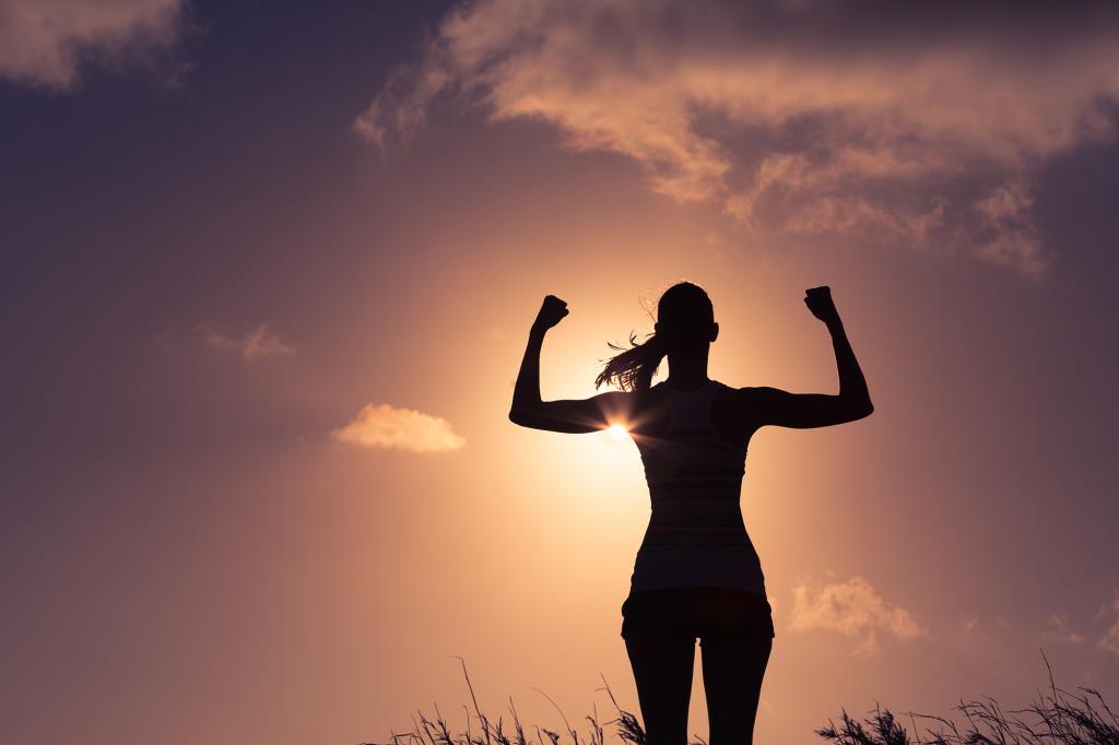 Strong and confident woman flexing her muscle. Woman power!