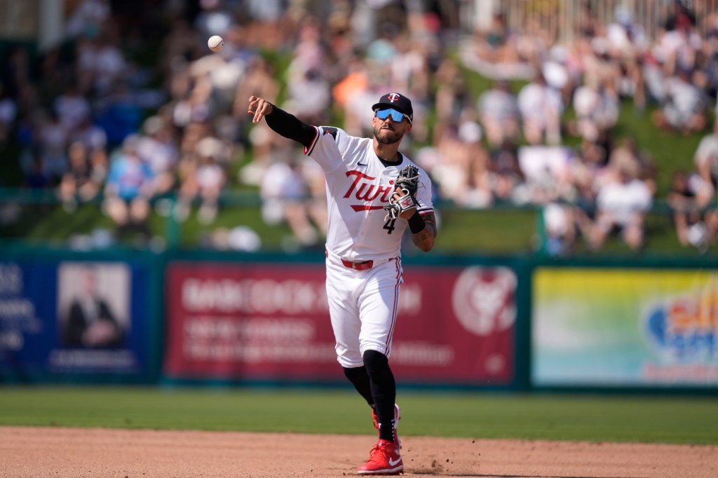 Minnesota Twins shortstop Carlos Correa (4) throws to first on a groundout by New York Yankees Everson Pereira to end the fourth inning of a spring training baseball game in Fort Myers, Fla., Saturday, March 9, 2024.