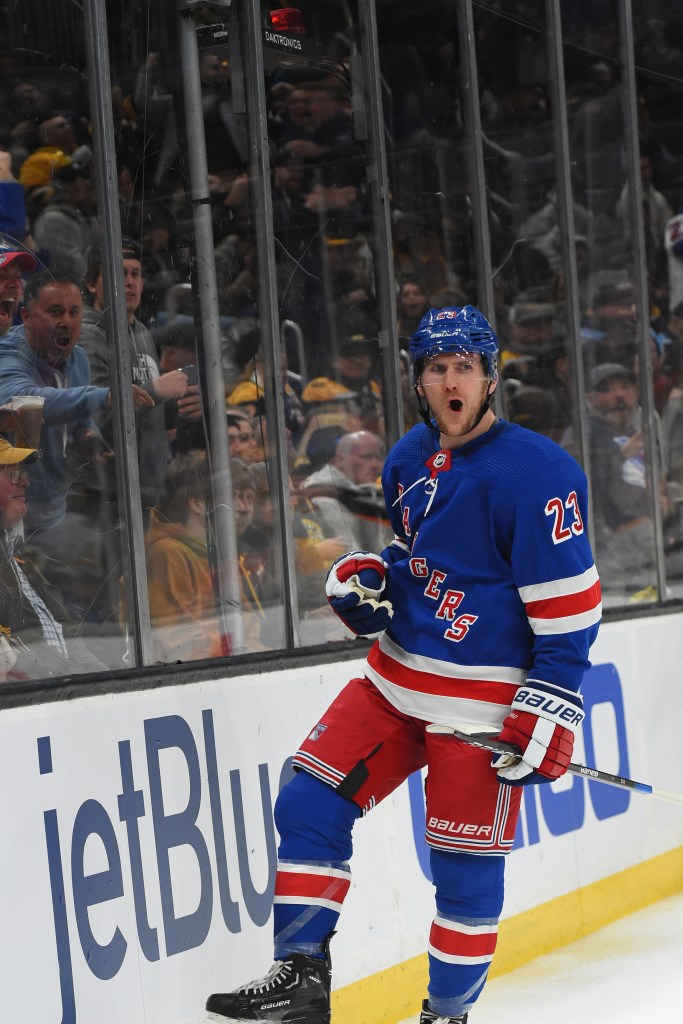 
Adam Fox #23 of the New York Rangers celebrates his third-period goal against the Boston Bruins at the TD Garden.