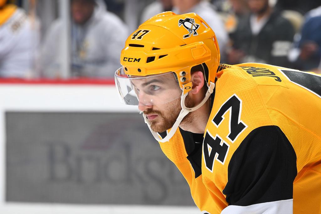 Adam Johnson #47 of the Pittsburgh Penguins skates against the Nashville Predators at PPG Paints Arena on March 29, 2019 in Pittsburgh, Pennsylvania.  