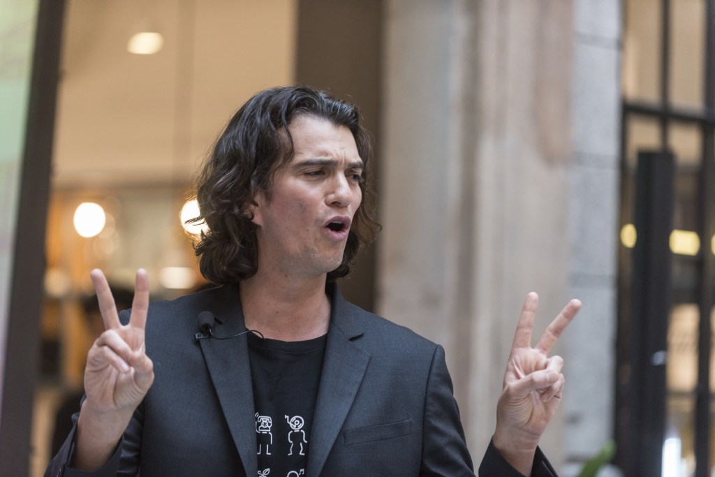 Adam Neumann speaking at a WeWork signing ceremony in Shanghai, China