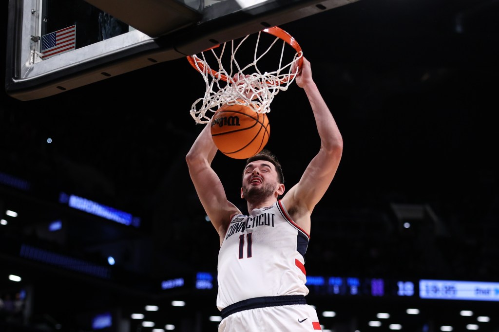 Alex Karaban #11 of the Connecticut dunks the ball during their win over Northwestern on Sunday.