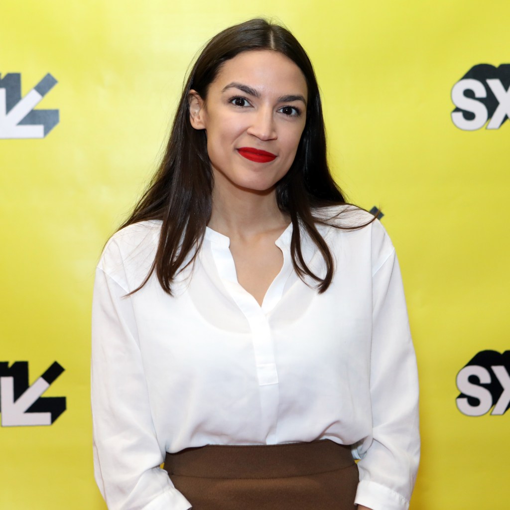 Rep. Alexandria Ocasio-Cortez standing in front of SXSW branding