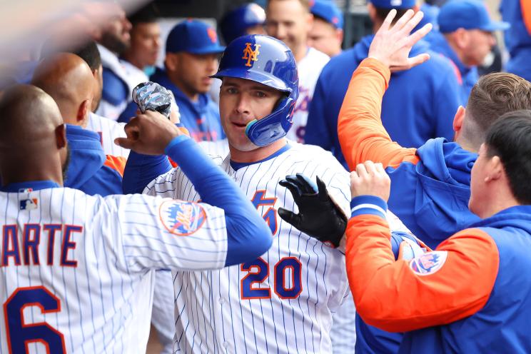 New York Mets first baseman Pete Alonso (20) is greeted by his teammates in the dugout after he scores on his two run homer during the 5th inning when the New York Mets played the Miami Marlins during Opening Day Saturday, April 8, 2023 at Citi Field in Queens, NY.