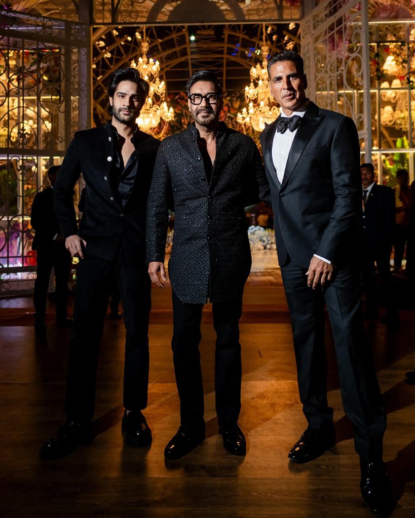 Some of India's biggest names also turned out to party at the billionaire's bash, including Bollywood stars Ajay Devgn (center) and Akshay Kumar (right). 