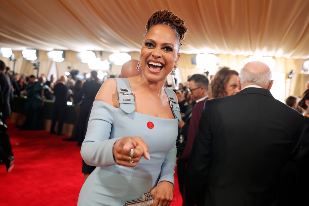 Ava DuVernay wears a light blue gown on the Oscars red carpet.
