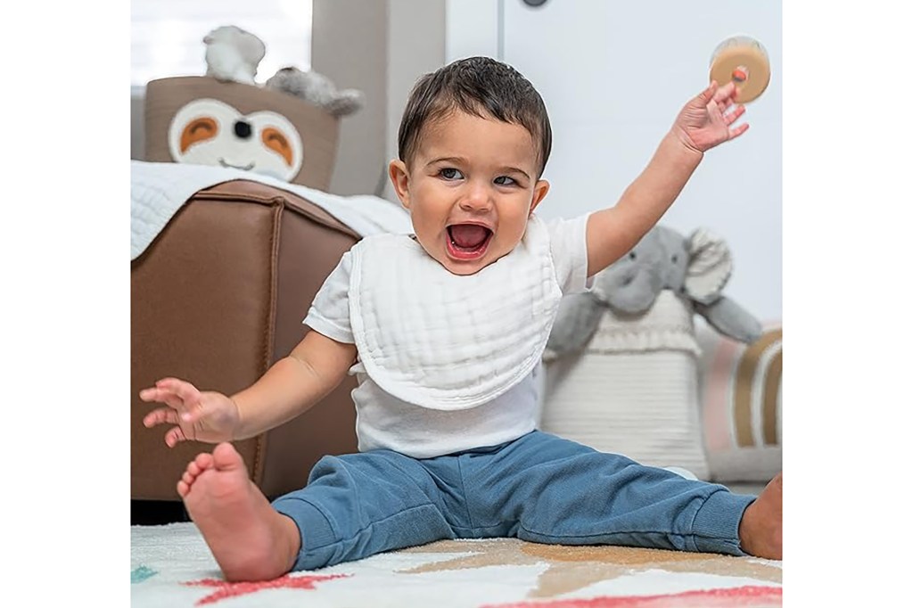 A baby sitting on the floor