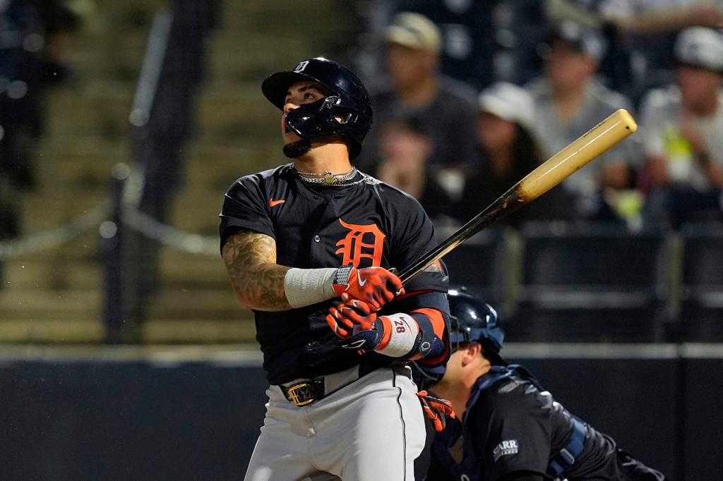 Detroit Tigers' Javier Baez hits a single during the first inning of a spring training baseball game against the New York Yankees Thursday, March 7, 2024, in Tampa, Fla.