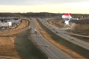 Dramatic video shows a hot air balloon suddenly crashing into a power line while trying to land in Minnesota.