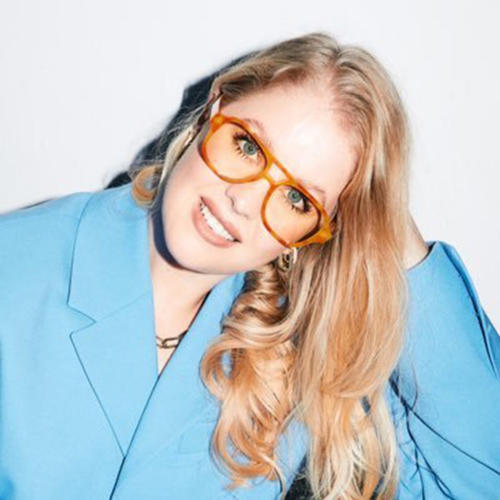 Bianca Rangecroft wearing glasses and a blue jacket
