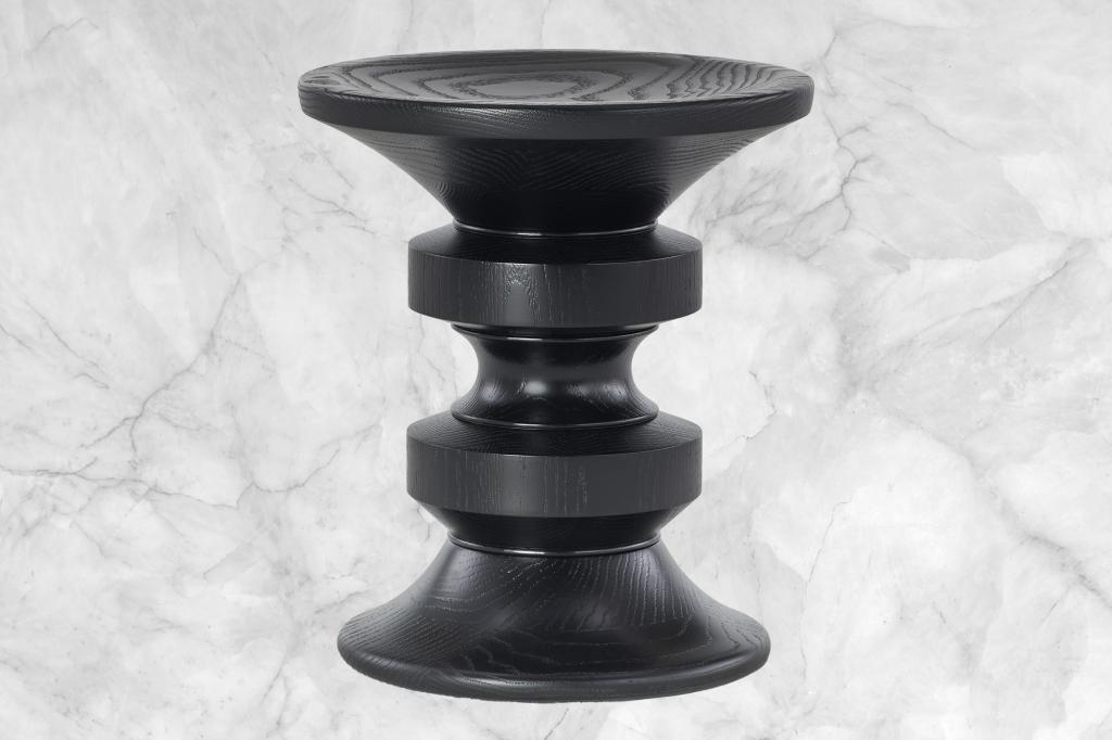 A black stool on a marble background