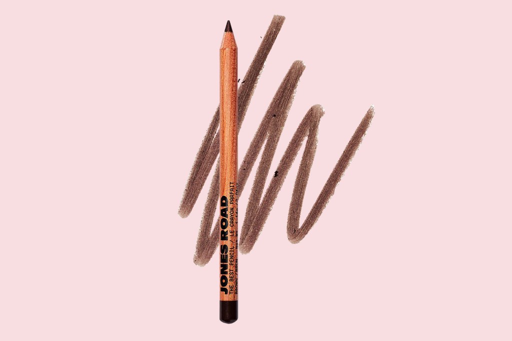 A brown pencil with a line of brown paint