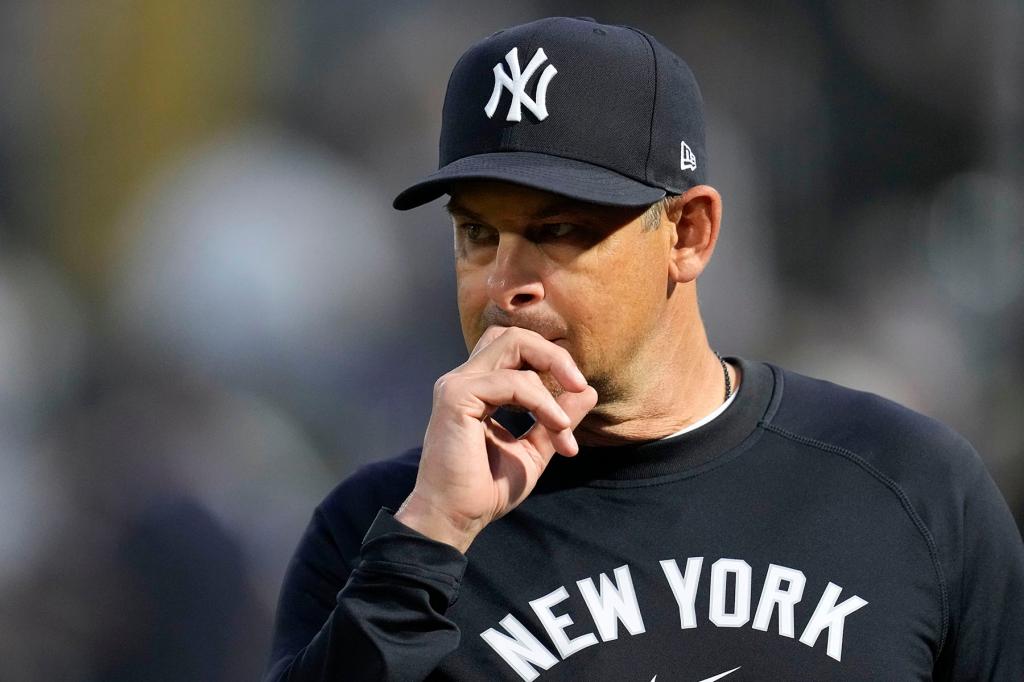 New York Yankees manager Aaron Boone walks on the field before a spring training baseball game against the Toronto Blue Jays Friday, March 1, 2024, in Tampa, Fla. 