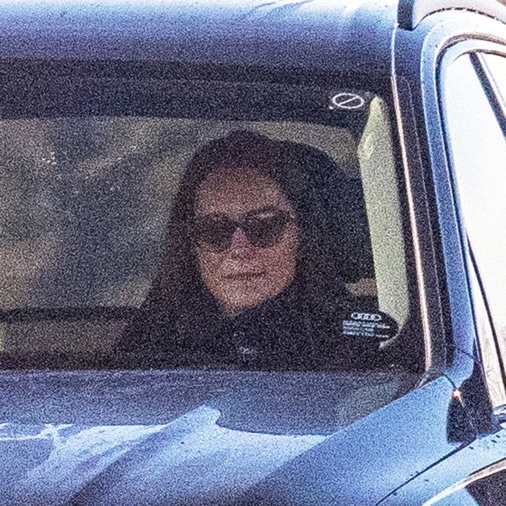 a woman driving a car with a passenger