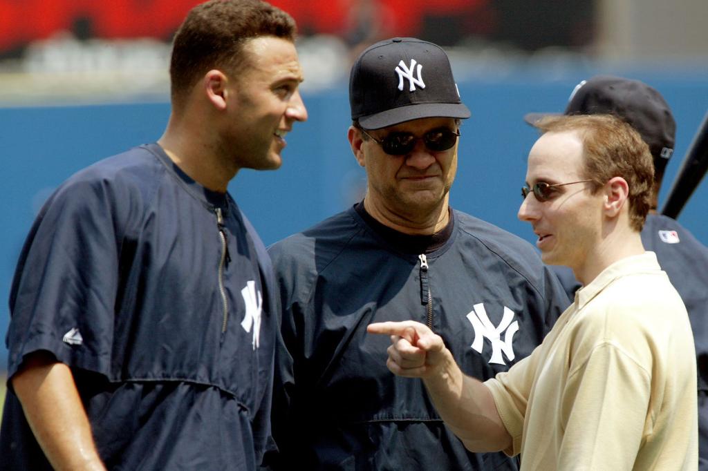 New York Yankees Derek Jeter jokes with Brian Cashman and Joe Torre before the game at Yankee Stadium, Friday, July 4, 2003.  