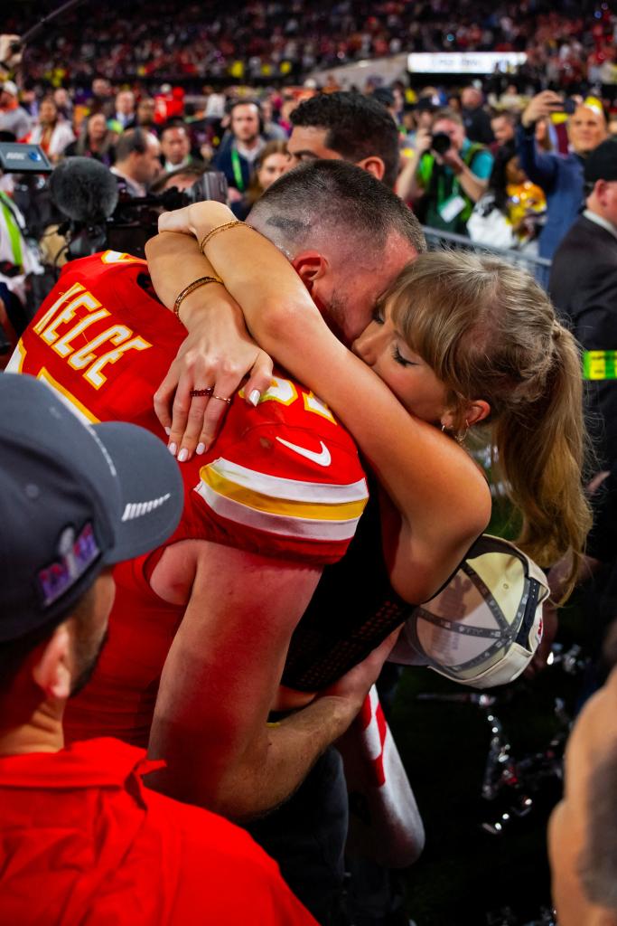 Travis Kelce and Taylor Swift embrace at Super Bowl 2024.