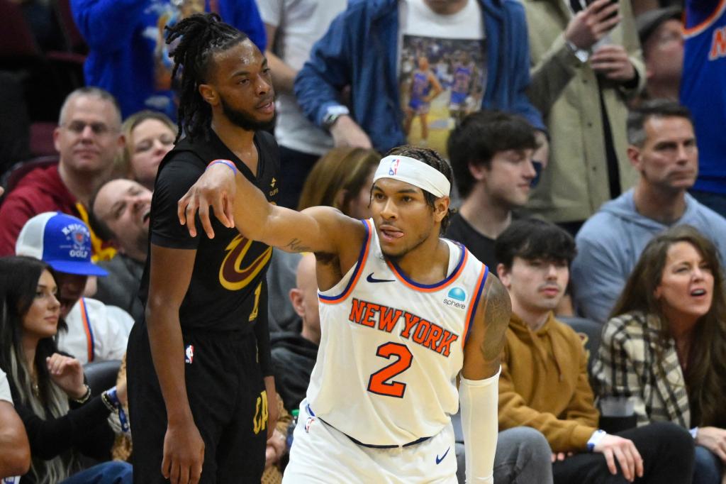 New York Knicks' Miles McBride (2) celebrates three-point basket in front of Cleveland Cavaliers' Darius Garland (10) at Rocket Mortgage FieldHouse.