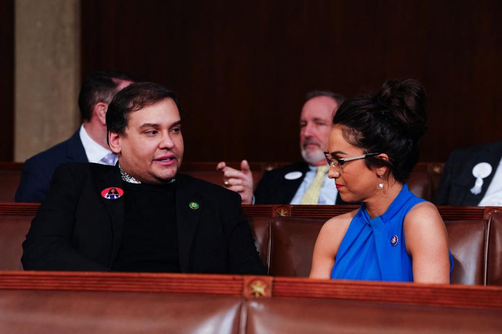 Former Republican Representative from New York George Santos (L) chats with US Representative Lauren Boebert (R-CO) (R) ahead of US President Joe Biden's third State of the Union address.