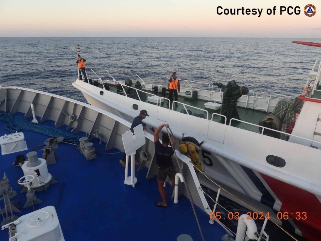 Chinese Coast Guard ship collides with Philippine Coast Guard ship on waters of South China Sea.