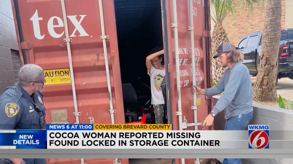 Marlene Lopez, 52, is seen emerging from a shipping container in Cocoa, Florida, on Thursday