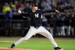 New York Yankees Pitcher Gerrit Cole (45) delivers a pitch to the plate during the spring training game between the Toronto Blue Jays and the New York Yankees.