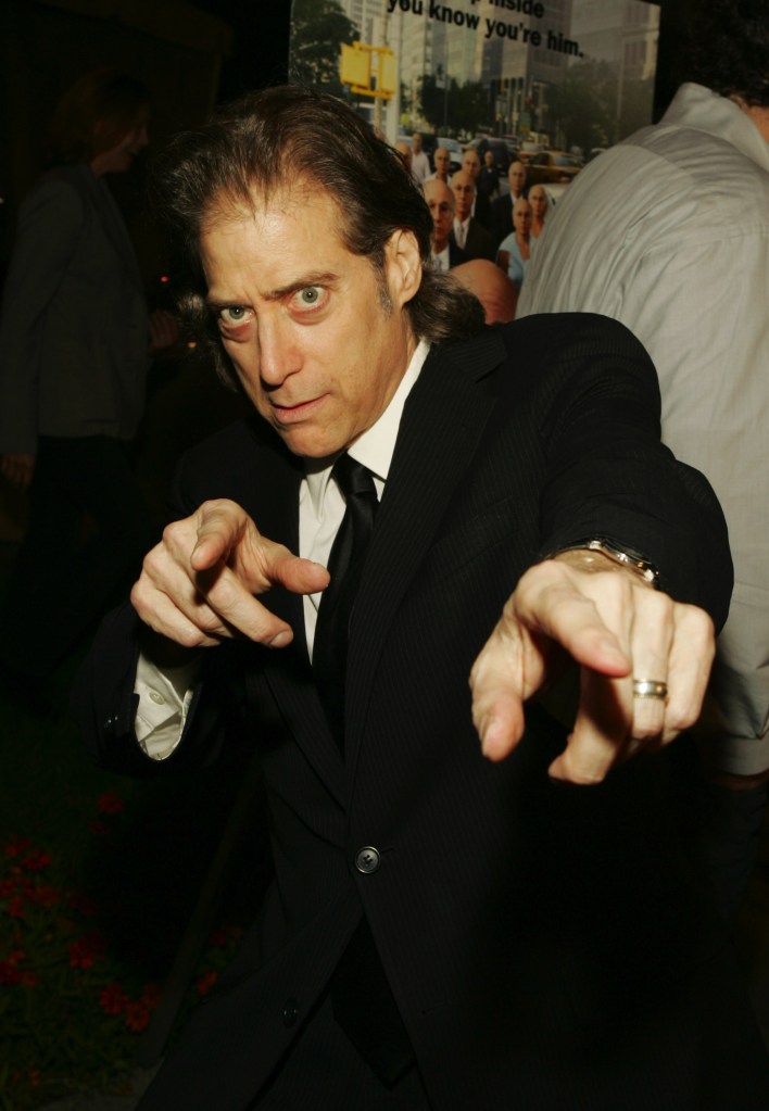 Richard Lewis pointing at the camera. 