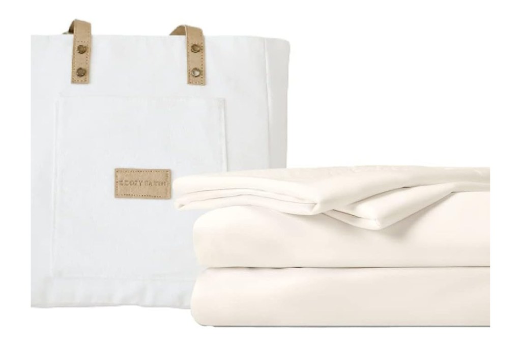 A stack of white bedding and a white bag