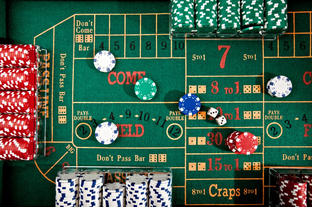 craps table layout with chips and dice